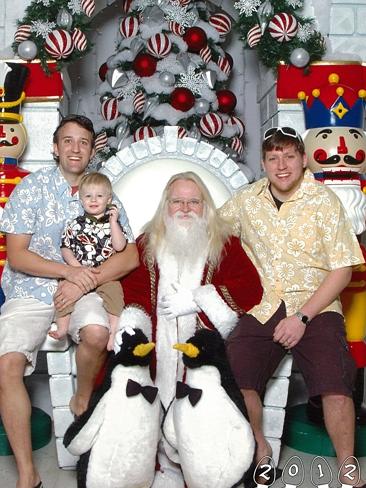 2012 ... Mike and Martin hope to indefinitely continue their Santa photo tradition. Picture: Martin Gray 