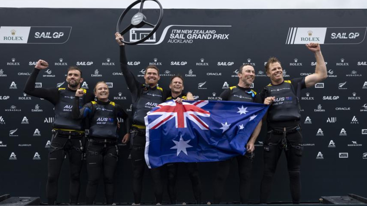 Australia SailGP Team helmed by Tom Slingsby and his team celebrate winning the New Zealand Sail Grand Prix in Auckland. Photo: Brett Phibbs for SailGP.