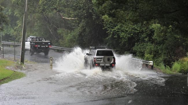 The torrential rain on the Mid North Coast has caused minor flooding across the region. In Upper Orara some roads are already being inundated with water. Photo: Tim Jarrett