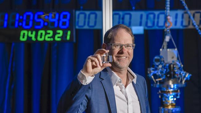 Cryoclock director Andre Luiten in the new laboratory at Lot Fourteen, he is seen holding a Sapphire crystal that sends a stable frequency to radars of the ionosphere for calibration. Picture: Roy VanDerVegt.