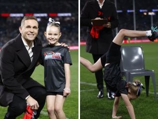 Evelyn Soldani performs a handstand