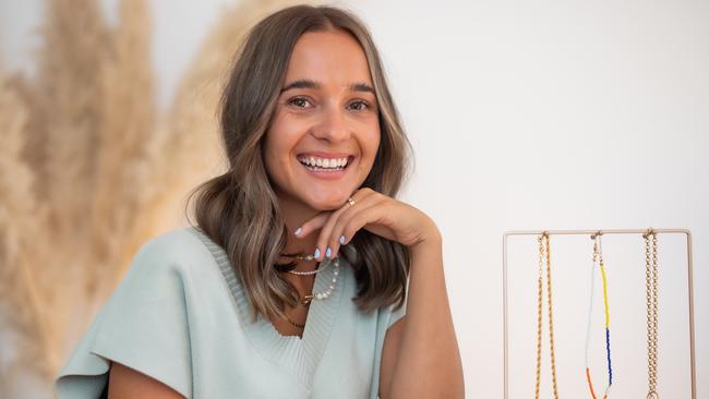 Olivia Burke, 26, partner of Richmond star Tom Lynch, launched Moins Est Plus, a jewellery line during the pandemic. Picture: Jason Edwards.