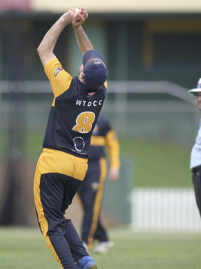 West Torrens' Ben Williams catches Woodville's Tom Andrews, off the bowling of Josh Dascombe. Picture: AAP/Dean Martin