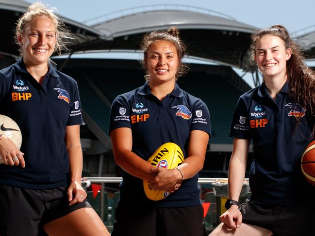 Eloise Jones, right, in 2017 after being drafted into the AFLW by the Crows, alongside team-mates Marijana Rajcic and Ruth Wallace. Picture: FILE