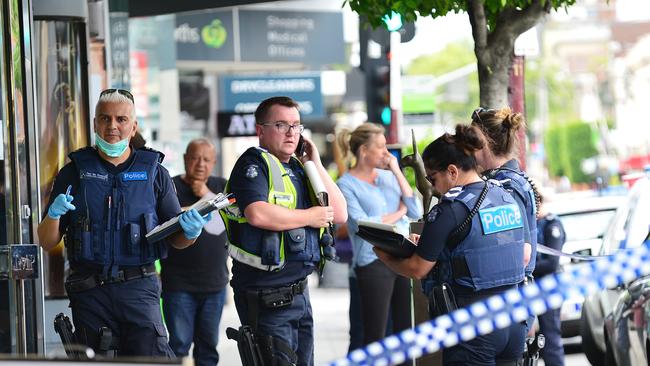 Investigators at the scene of the armed robbery of the Toorak jewellery store, which had been targeted for second in the three months. Picture: Nicki Connolly