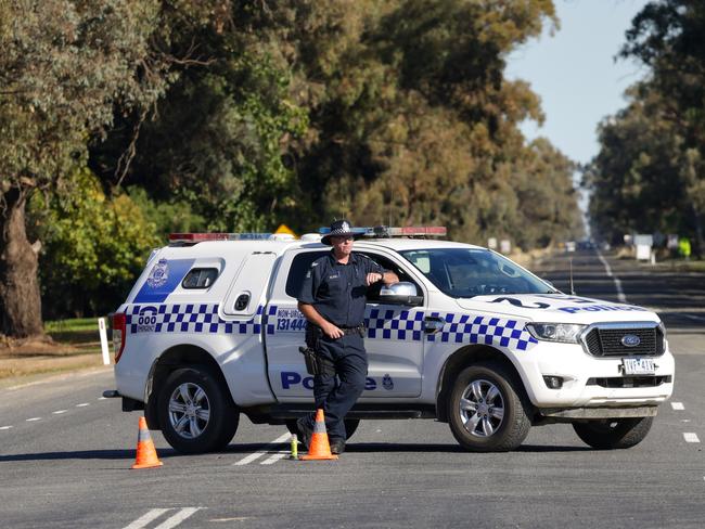 Officers at the scene of the collision in Strathmerton which resulted in the deaths of five people. Picture: Ian Currie