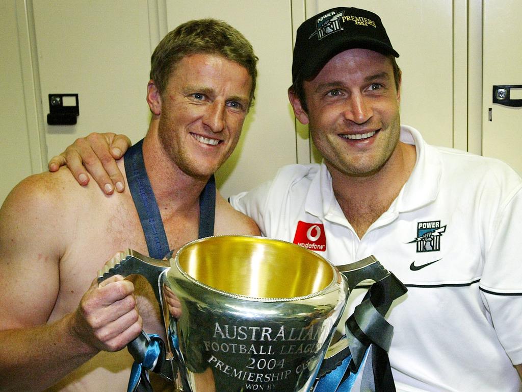 Hardwick pictured with Matthew Primus after winning the premiership with Port Adelaide in 2004.