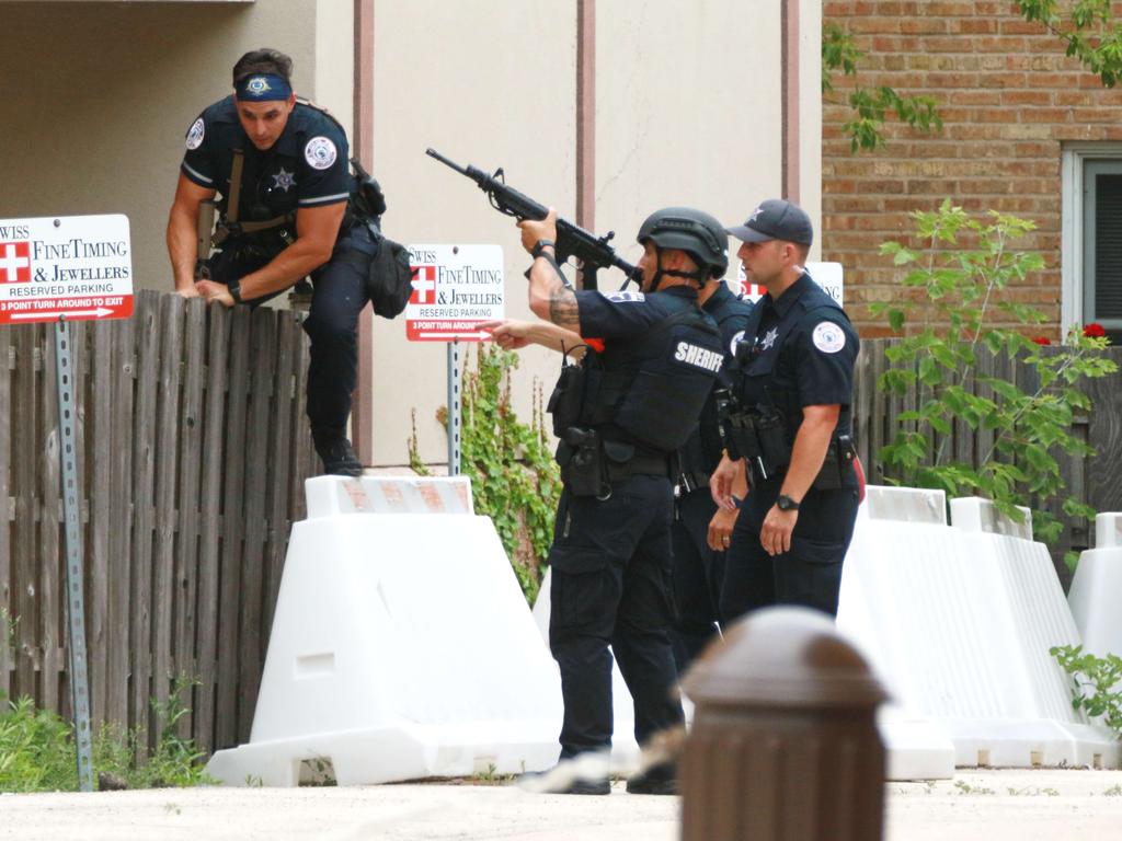 Police search the area of a shooting in Highland Park, Illinois. Picture: Mark Borenstein/Getty Images/AFP.