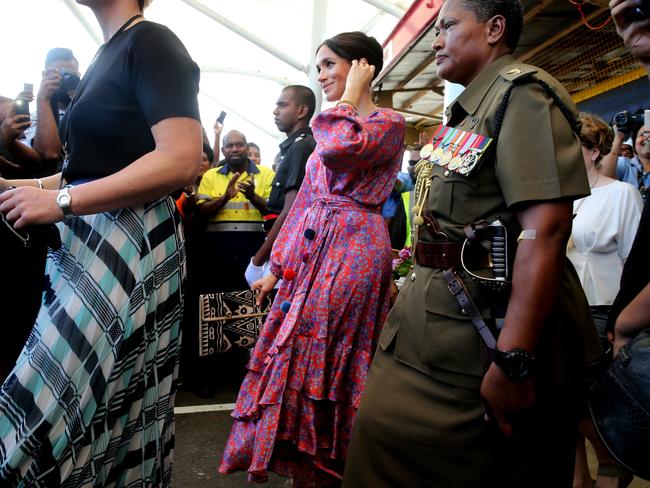 Before her visit was dramatically cut short, Meghan spoke to female vendors from a UN Women’s project. Picture: Nathan Edwards