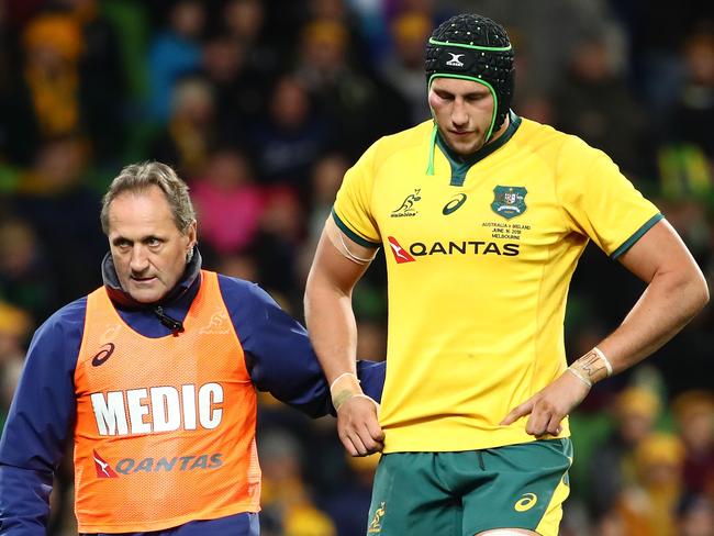 A sick and sorry Coleman leaves the field in Melbourne. Picture: Getty Images