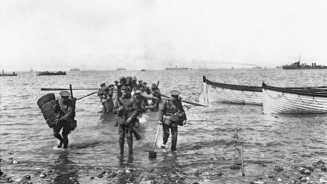 Divisional headquarters staff wade ashore at Anzac Cove on April 25, 1915. Picture: Charles Edwin Woodrow Bean