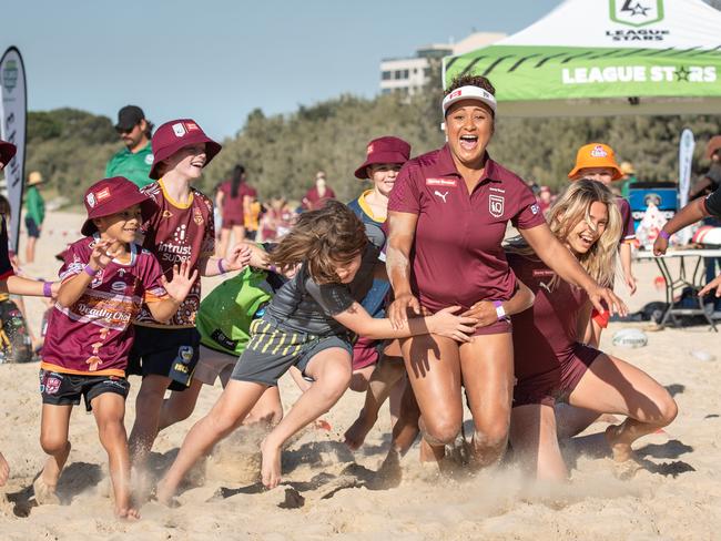 20-06-2021 Queensland womenÃs rugby league State of Origin players Shania Power and Julia Robinson are tackled by fans on Mooloolaba Beach on the Sunshine Coast. PICTURE: Brad Fleet