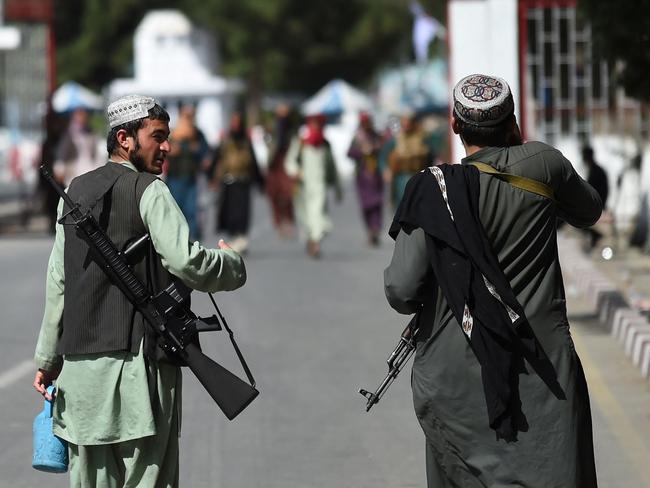 Taliban fighters at the main entrance gate of Kabul. Picture: AFP