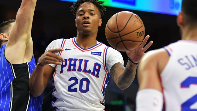 PHILADELPHIA, PA - OCTOBER 20: Markelle Fultz #20 of the Philadelphia 76ers dishes off a pass to teammate Ben Simmons #25 while being defended by Nikola Vucevic #9 of the Orlando Magic at Wells Fargo Center on October 20, 2018 in Philadelphia, Pennsylvania. Drew Hallowell/Getty Images/AFP == FOR NEWSPAPERS, INTERNET, TELCOS &amp; TELEVISION USE ONLY ==