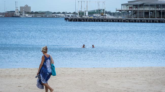 Early swimmers make the most of Monday morning’s cooler temperatures. Picture: Jake Nowakowski