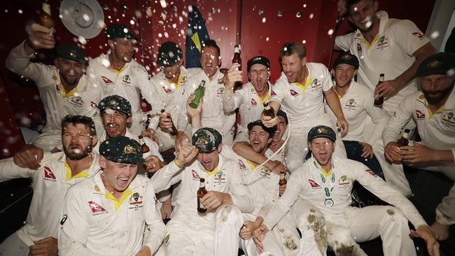 The Australian Cricket Team enjoy a drink in the change rooms at Old Trafford.