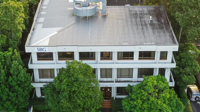 Three-level building, on the corner of Bundall Rd and Crombie Ave, occupied by the Short Punch and Greatorix practice.