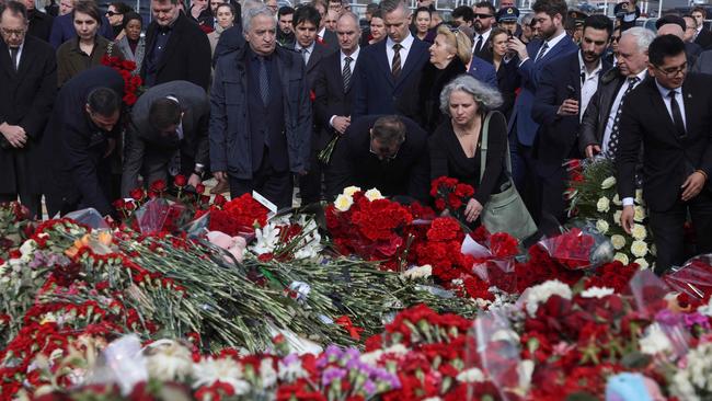 Ambassadors to Russialay flowers at the memorial in memory of the victims of the terrorist attack at the Crocus City Hall concert venue. Picture: AFP.