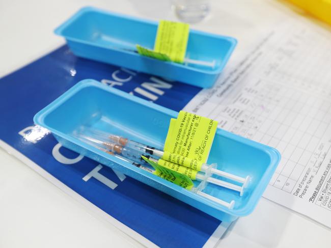 BRISBANE, AUSTRALIA - AUGUST 11:  Pfizer vials are seen on the opening day of the COVID-19 vaccination hub at Brisbane Convention and Exhibition Centre on August 11, 2021 in Brisbane, Australia. The vaccination hub will provide the Pfizer vaccine and second dose of AstraZeneca to individuals with bookings as Queensland opens the vaccine registration list state-wide to anyone over 16. The Australian government says 70% of eligible Australians must be fully vaccinated before the country reopens. (Photo by Tara Croser - Pool/Getty Images)