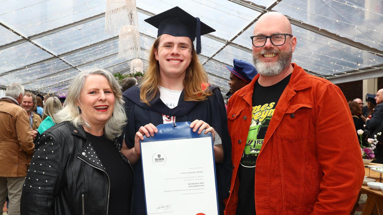 Deakin graduate Coby Heinze with parents Amanda and Clint. Picture: Alison Wynd