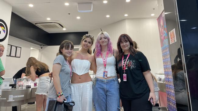 Laura Parry (17), Nicole Gomes Da Costa (17), Paris Hodges (17), and Izabel Boaldin (7) waiting for piercings in the Paradise Centre. Picture: Georgina Noack