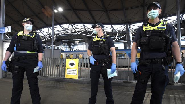 Police and PSOs enforcing mask-wearing Southern Cross Station. Picture: Andrew Henshaw