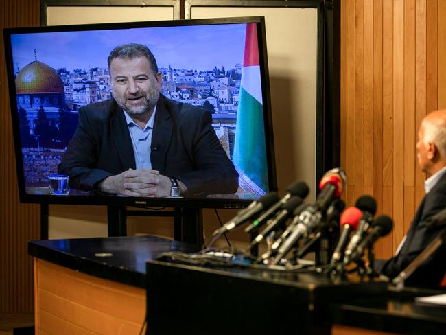 Senior Fatah official Jibril Rajoub, in the West Bank city of Ramallah, attends by video conference a meeting with deputy Hamas chief Saleh Arouri (on screen from Beirut) discussing Israel's plan to annex parts of the Israeli-occupied West Bank, on July 2, 2020. (Photo by ABBAS MOMANI / AFP)