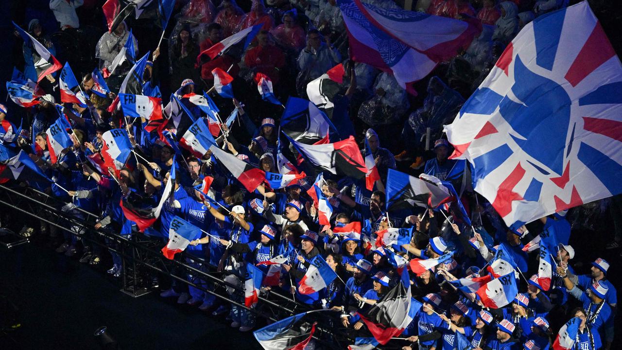 Supporters waved French flags during the carnival atmosphere at the Paris 2024 Paralympic Games Closing Ceremony. Picture: Francois-Xavier Marit/AFP