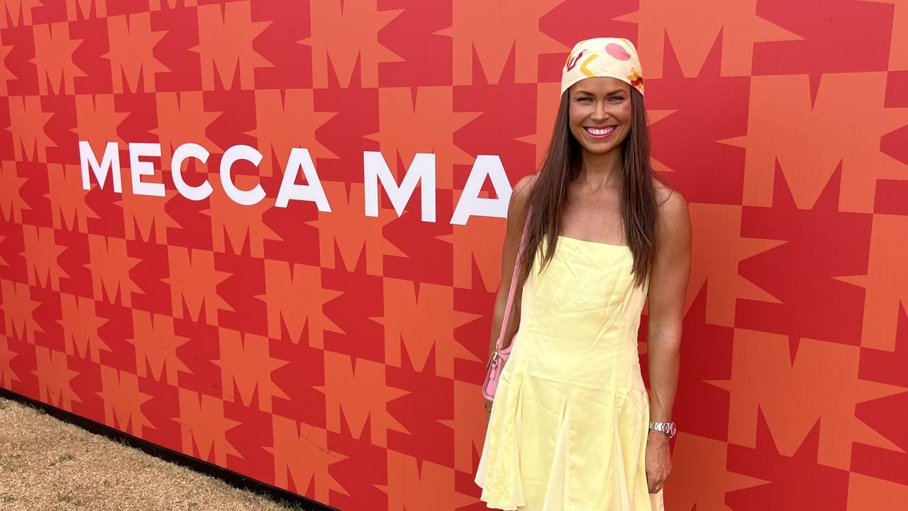 F1 fan Stephanie in front of the Mecca pop-up at the Australian Grand Prix. Picture: Stephanie Coombes