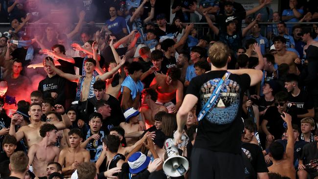 Sydney FC supporters cheer during the A-League Men round 19 match between Western Sydney Wanderers and Sydney FC at CommBank Stadium. It is not suggested any of the fans pictured were involved in any wrongdoing. Picture: Getty Images