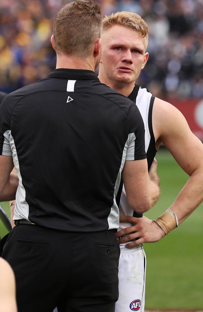 Adam Treloar was consoled by coach Nathan Buckley after the devastating Grand Final loss to West Coast. Picture: Phil Hillyard