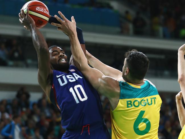 Kyrie Irving #10 of United States shoots over Andrew Bogut.