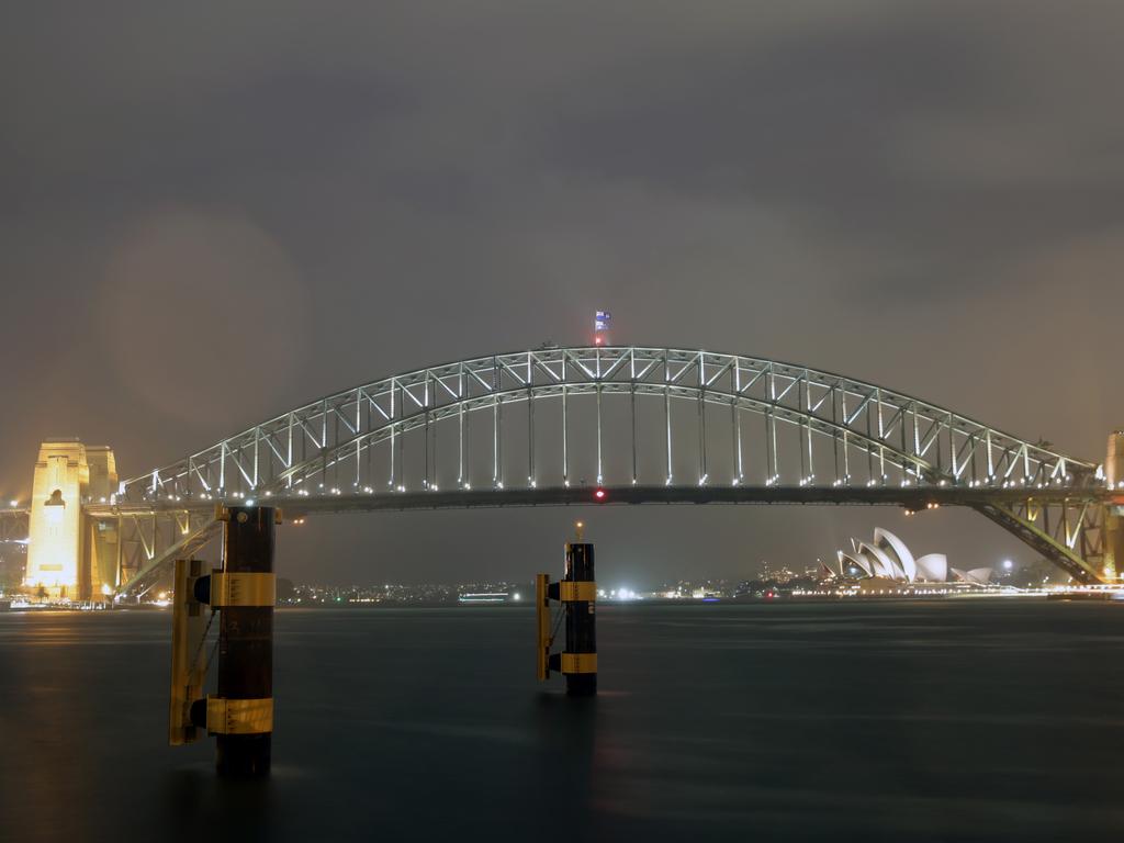 Pictured from Blues Point in North Sydney is the Harbour Bridge during tonight's thunderstorm. Picture: Christian Gilles