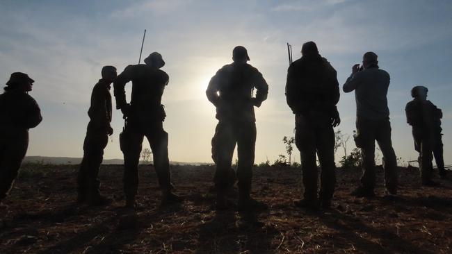 Members from Brigade Headquarters observe the clearance from a high feature. Picture: Harry Brill.