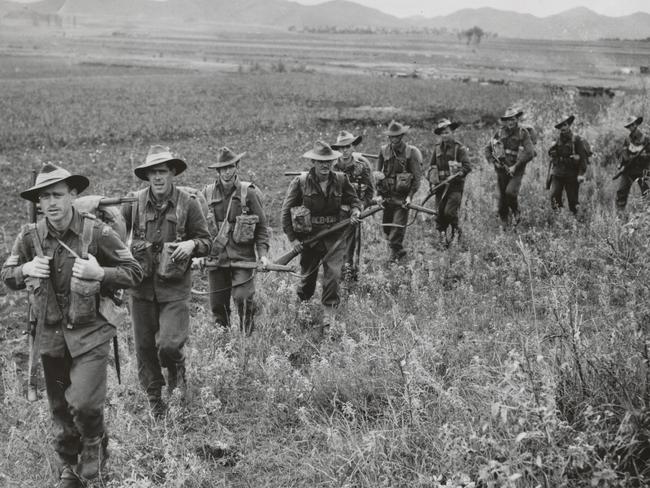 Soldiers from A Company, 3RAR, move through a paddy field near Pyongyang. Picture: A. Gulliver/SLV