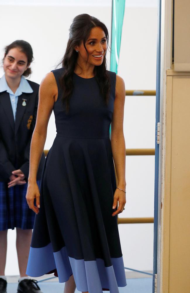 The Duchess of Sussex wore this stunning designer dress during a visit to a Sydney high school last year. Picture: Phil Noble — Pool/Getty Images