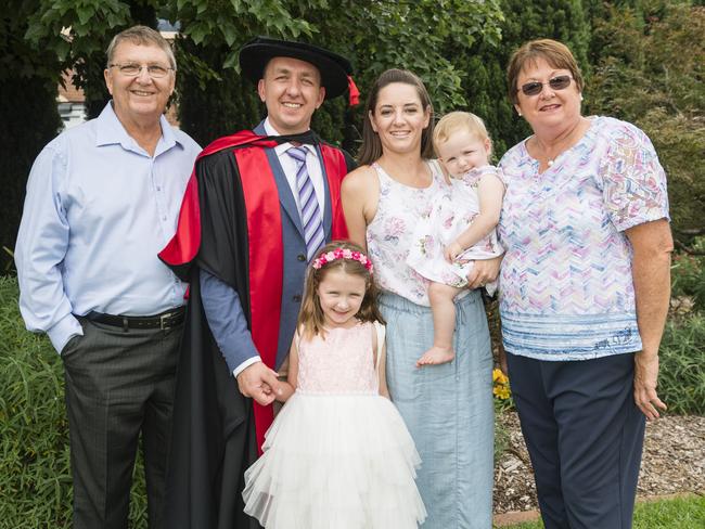 Master of Psychology / PhD graduate Etienne Roux with family (from left) Koos Roux, Hailey Roux, Zile Roux holding Liane Roux and Louise Roux at a UniSQ graduation ceremony at Empire Theatres, Tuesday, February 13, 2024. Picture: Kevin Farmer