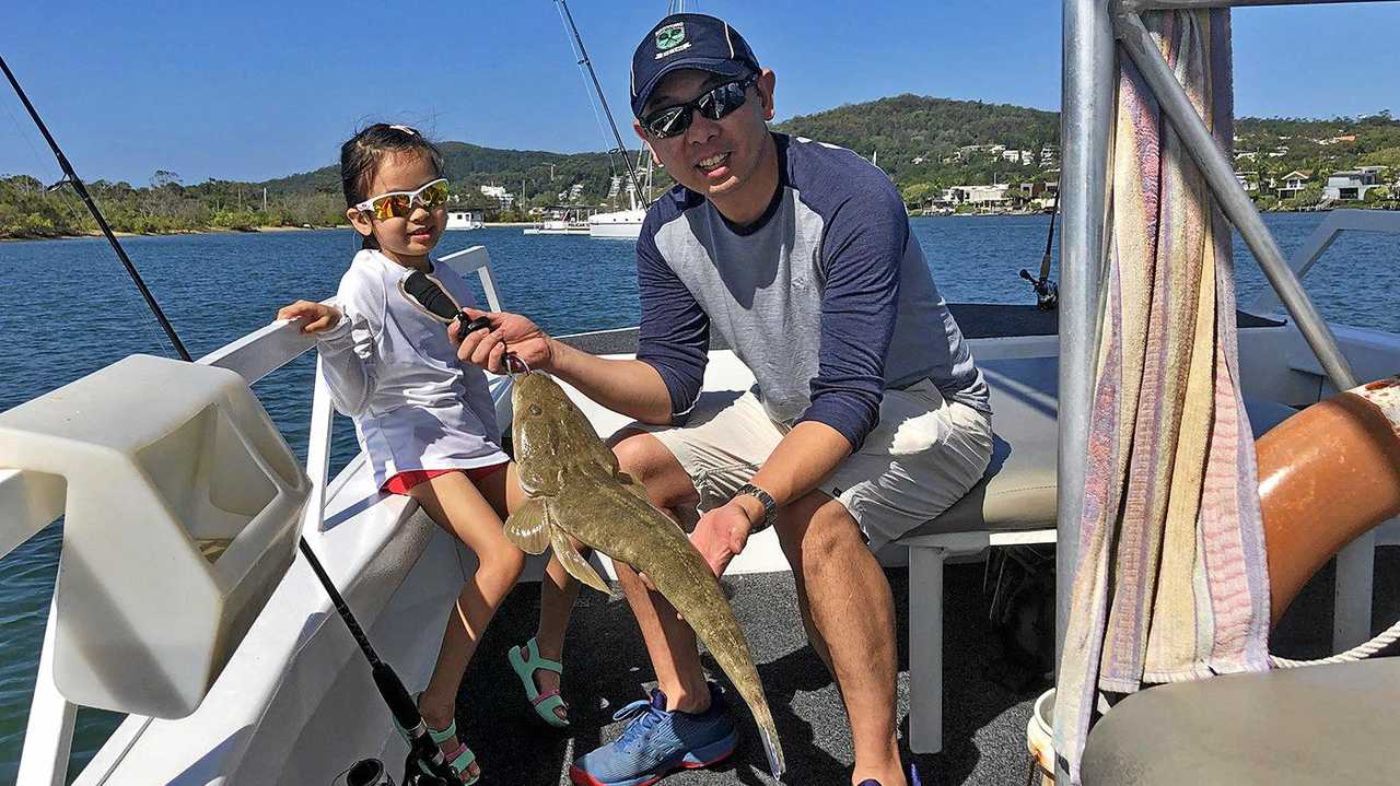 Gotcha - Chuan Wong and his daughter Chloe boated this 70cm flathead in the lower estuary while on a Noosa River Fishing Safari. Picture: www.fishingnoosa.com.au