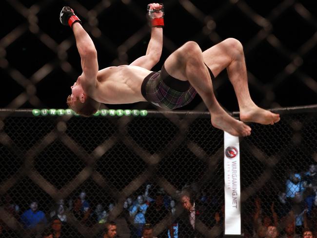 Jake Matthews performs a backflip after beating Vagner Rocha.
