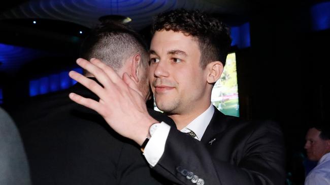 Tom Gribble is embraced by teammates. Photo: AFL Photos via Getty Images.