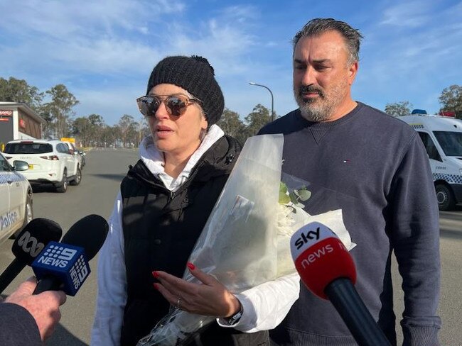 Kim and John Grecho near the crash site on Monday morning. Picture: News Corp