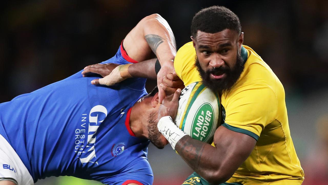 Marika Koroibete of the Wallabies breaks a tackle against Samoa.