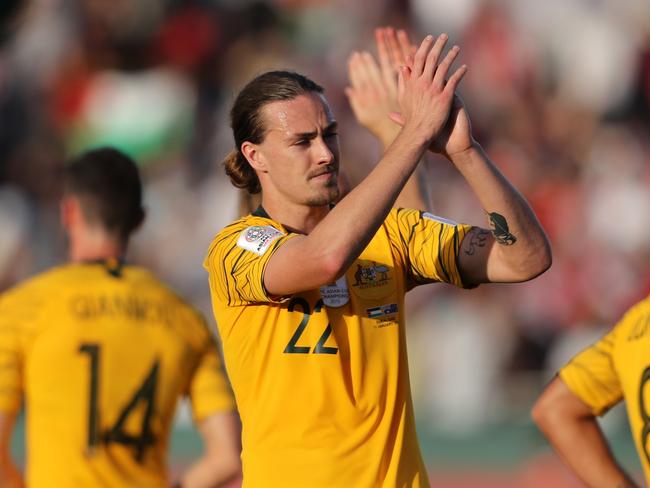 DUBAI, UNITED ARAB EMIRATES - JANUARY 11:  Jackson Irvine of Australia and his team mates celebrate following their sides victory in  the AFC Asian Cup Group B match between Palestine and Australia at Rashid Stadium on January 11, 2019 in Dubai, United Arab Emirates. (Photo by Francois Nel/Getty Images)