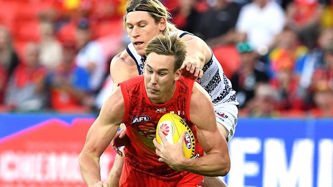 Tom Lynch takes a mark in Gold Coast’s big loss to Geelong.