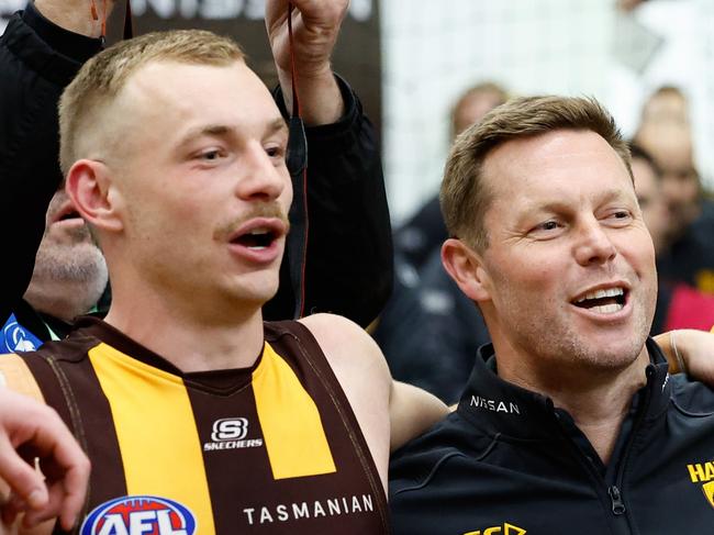 MELBOURNE, AUSTRALIA - SEPTEMBER 06: Sam Mitchell, Senior Coach of the Hawks sings the team song during the 2024 AFL Second Elimination Final match between the Western Bulldogs and the Hawthorn Hawks at The Melbourne Cricket Ground on September 06, 2024 in Melbourne, Australia. (Photo by Dylan Burns/AFL Photos via Getty Images)