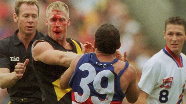 Matthew Knights and Tony Liberatore clash at the MCG.