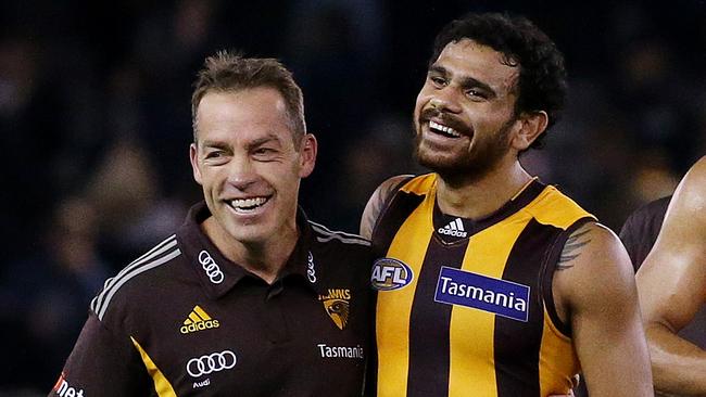 AFL - North Melbourne v Hawthorn at Etihad Stadium , Hawthorn's Cyril Rioli gets a hug from coach Alastair Clarkson after the win. 17th June 2016. Picture: Colleen Petch.