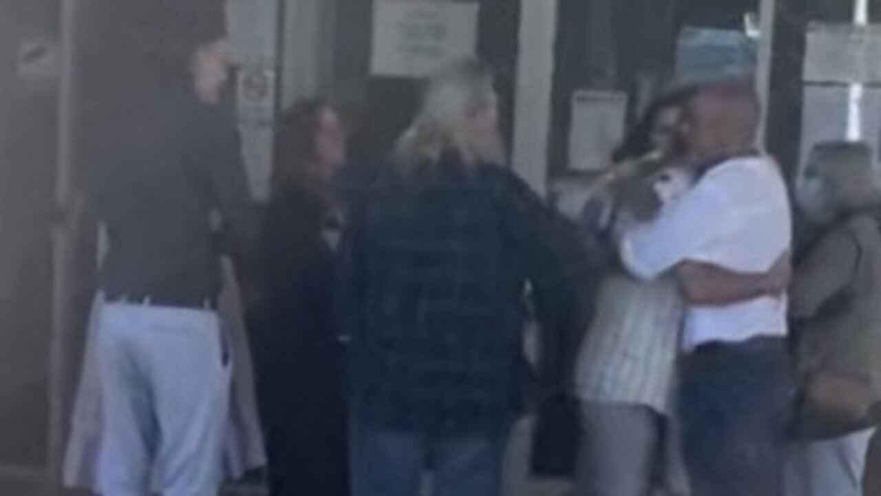 Nathan Cortes (striped white shirt) hugged his supporters outside Gympie Magistrates Court on Thursday afternoon.