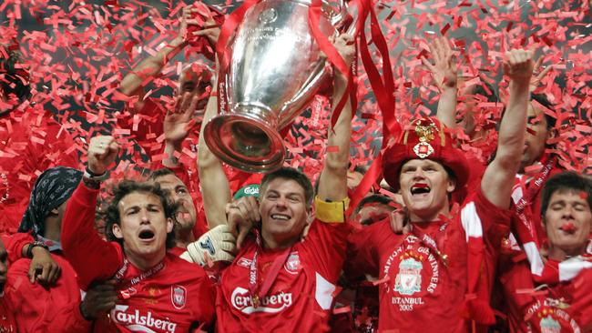 (FILES) This file photo taken on May 25, 2005 shows Liverpool's captain Steven Gerrard as he holds the throphy surrounded by teammates at the end of the UEFA Champions league football final AC Milan vs Liverpool, at the Ataturk Stadium in Istanbul. Liverpool won 3-2 on penalties. Former Liverpool and England captain Steven Gerrard announced his retirement from professional football on November 24, 2016, at the age of 36, calling time on an emblematic career. His finest hour came in Istanbul in May 2005, when he inspired Liverpool to come from 3-0 down against AC Milan at half-time of the Champions League final to win the club's fifth European Cup. / AFP PHOTO / Filippo MONTEFORTE