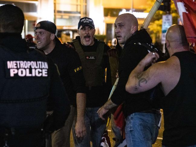 Members of Antifa and Proud Boys clash in the middle of the street following the Million MAGA March in Washington, DC. Picture: Getty Images/AFP